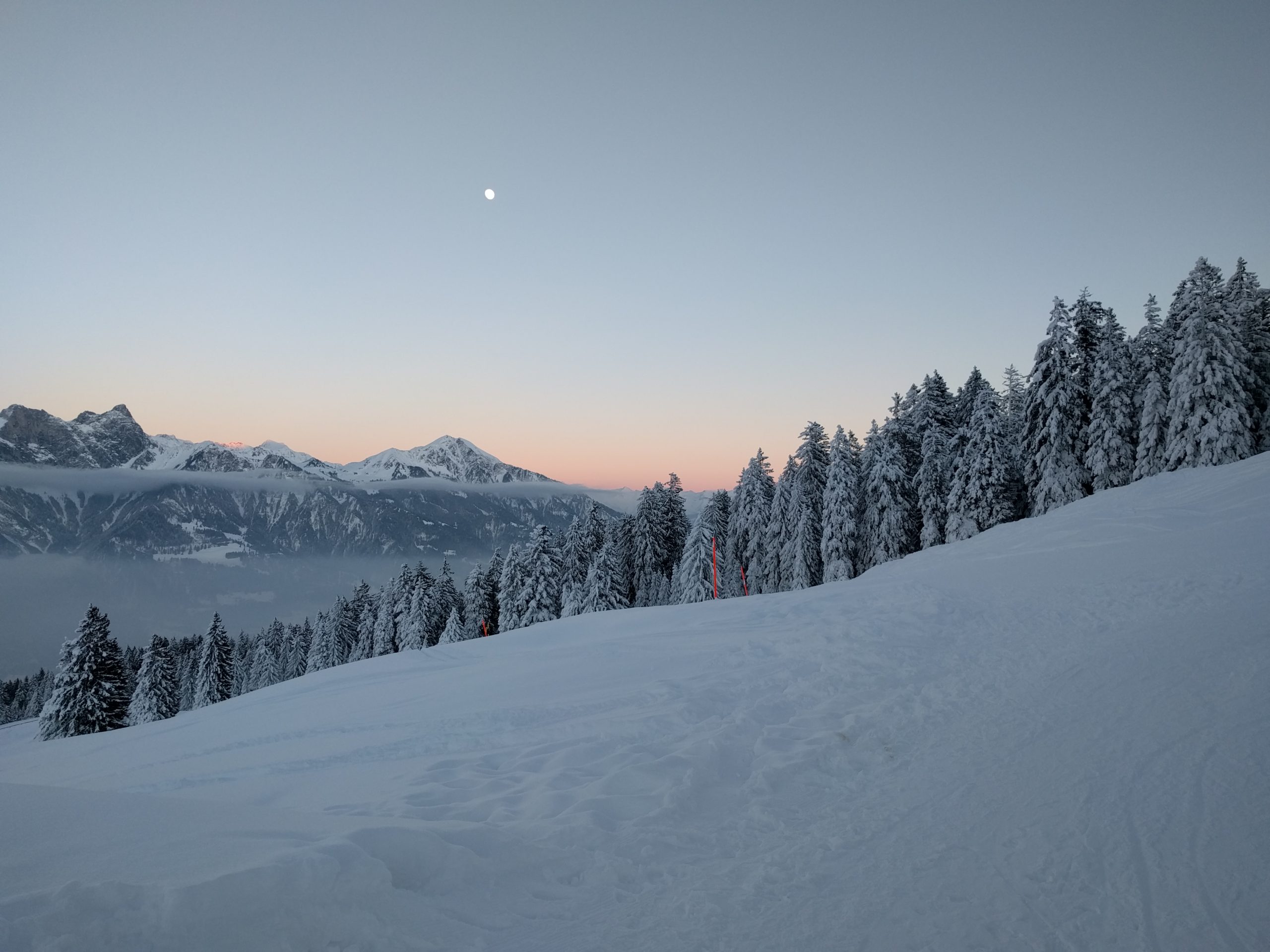 Sunset over empty ski slopes