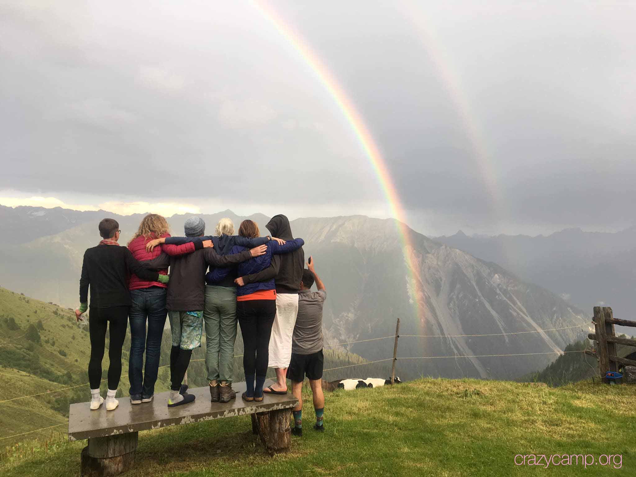 Crazy Campers watching the double rainbow in front of the hut